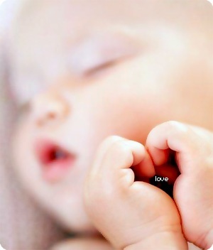 baby love - a lovely sleepy baby with heart-shaped hands