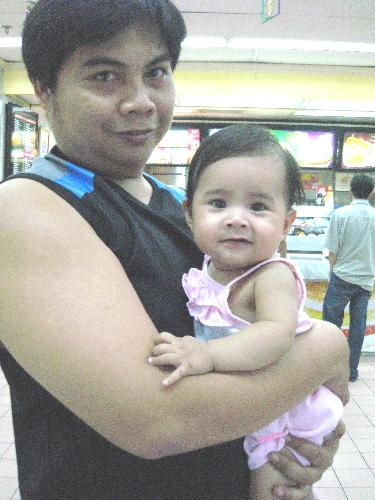 Norman and Nazey - This isa 'father-daughter' picture that was taken by me inside a food chain (resto) in Marikina City. We were just came from my mom when after that we wanna treat our daughter some food she'd loved to eat that time. The picture just came out to be good and one of my favorite picture! They're my life now..