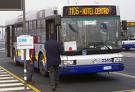 transportation vehicles - a bus stopping at a bus stop