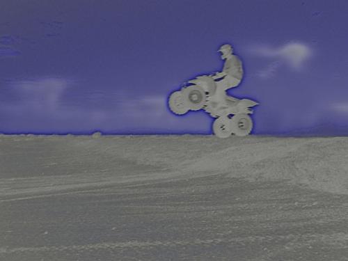 me on my quad - me goin ova a small jump in mu quad