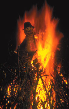 Guy on Bonfire - A Guy Fawkes effigy being burnt on a bonfire on November 5th in celebration of the foiling of the Gunpowder Plot. Guy on Bonfire - A Guy Fawkes effigy being burnt on a bonfire on November 5th in celebration of the foiling of the Gunpowder Plot.