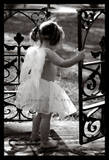 a n angel child opening a gate - a precious photo of a young churub opening a gate