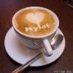 mylot.. - A cup of coffee with mylot written with cream on it...