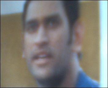 indian captain - strong batsman.well built body.one day captain of indian team.wicketkeeper batsman with very high strike rate.