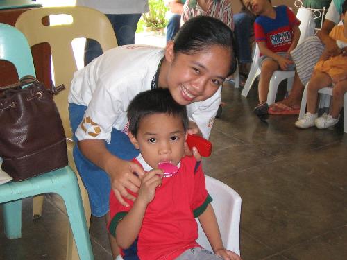 Spending Time with an Orphan Kid - Hi there! It really feels good whenever we have done good deeds especially when we make people happy which I do believe would really make an everlasting imprint in the hearts of ones whom we had helped or cheered.  In this photo, I was with an orphan boy and I'm so sorry for having forgotten his name. He's an orphan. I really don't know the story behind his being orphan and I don't want to know about it. All I want is to cheer him up that time. :)