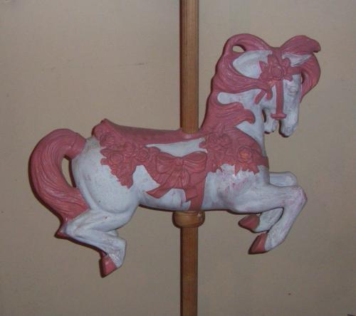 Carosel Horse -  Ther's a horse in my dinning room, Small carosel horse on pole.