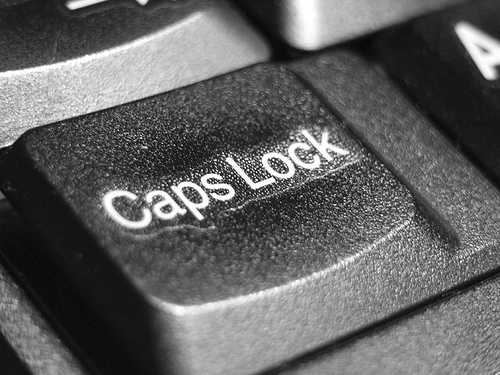 Do you use CAPS LOCK when typing capital letters? - A picture zooming in on the caps lock of a keyboard. Photo source: http://farm1.static.flickr.com/94/243160597_41dabbf95d.jpg?v=0 .