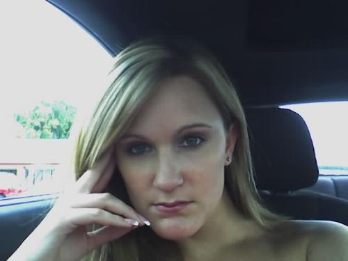 Me again - This was me sitting in a parking lot waiting for the doors to open at a wrestling show. My bf used to be a wrestler so I'd wait in the car instead of standing in a line in the heat! You can tell I look happy lol