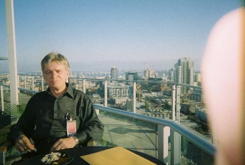 Russell At Rooftop Social In San Diego, California - Looks to me as if he's enjoying the food--but he actually didn't care for the food. Instead that look of pleasure comes from just being up on the rooftop where he can enjoy fresh air and a beautiful view way above the street-level of San Diego.  I'd love to see him give me a look like that one of these days when we finally have face time!