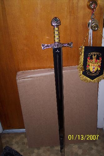 Family crest - This is the sword of Baggett, and crest that also came with a beautful seal and letter about where the family name came from. Do you have a family crest. I think it is so cool to find out where we all oringially came from, I wish I could travel to the places and read all about my own family.