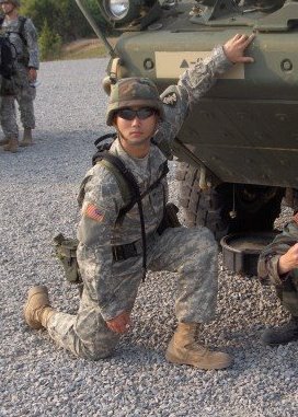 From when I was in the Army - Me posing in front of a Stryker.