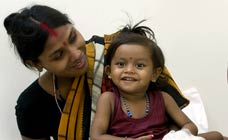 Lakshmi who was born with eight limbs - Lakshmi who was born with eight limbs is seen sitting with on her mother’s lap at a hospital in Bangalore. Doctors have successfully separated her from her conjoined twin and reconstructed her body after a marathon operation.