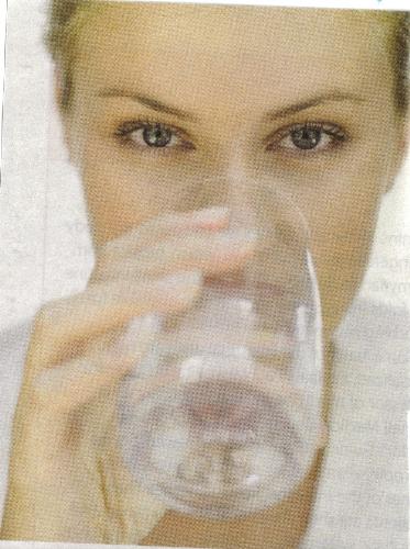 Drinking Water - A lady drinking water.