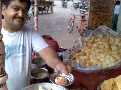 panipuri - This guy handed over a little metal dish,upon which he made a single pani puri (rather than the half dozen that I&#039;m used to).