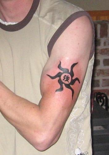 My New Tattoo - This is my first tattoo I recieved. It hurt, but what do you think of it. It is a Tribal Sun with the kanji symbol meaning'Strong' within the sun.