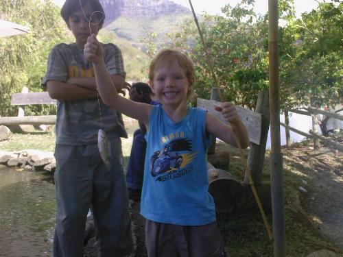 First Fish - So exciting to be able to do what boys do and catch fish. Now we need to graduate to being able to get them off the hook and thorw them back by ourselves ;-) First Fish - So exciting to be able to do what boys do and catch fish. Now we need to graduate to being able to get them off the hook and thorw them back by ourselves ;-)