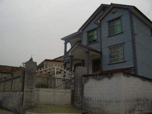 a Chinese farmer's house - This is the photo I took for my friend about his nice house close to the moutain behind in the village.