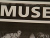 Muse - From their classic poster, the one where they are leaning against the wall that is sticker-plastered in black and white... yeah that one.