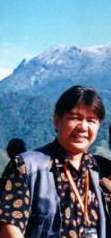 Photo with Mount Kinabalu in the background - This is a photo of me taken in the mountain near the Sabah National Park , a popular weekend destination both for locals and tourists.