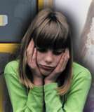 Depression - Photo of depressed girl. Blonde hair. Hands on face. 