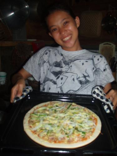 my 'ate' and her pizza - My ate likes cooking..