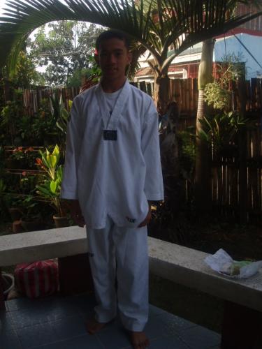 My bro - He recently won a silver medal(naks! Of course, I'm proud). Because at his first game or fight, he was fouled out because of his very low kick! haha! (it was so funny) I started teasing him and dared him to win a medal in the next competition.. Oh, well.. He won a silver medal..