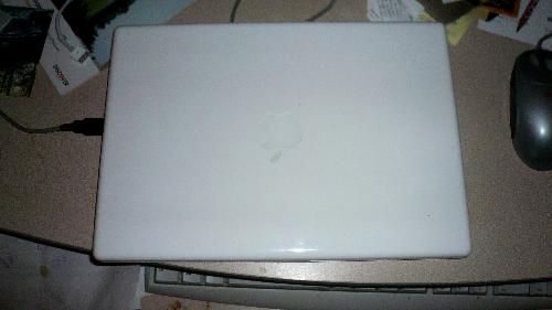 Laptop - Here is a picture of my new Macbook. I just bought this beautiful laptop last weekend as my Emachine died on me. I love this laptop very much and have both Mac and Windows XP on it so I can use programs for both operating systems. Mac has some really awesome features and will enjoy taking my laptop around with me.