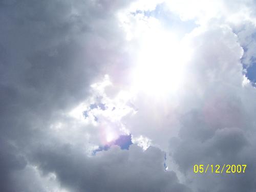 When the clouds break, the sun will shine! - Taken in the mist of a bad storm a break in the clouds the sun is still there and shining as always. To me it resembles life, it gets dark and scary at times but in time it will clear up and settle down.