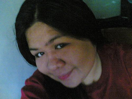 smiling photo - smiling face, fair complexion, has brown t-shirt, black hair, brown eyes, no pimples, red lips, round face