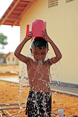 A refreshing bath - A little boy pouring water and bathing A refreshing bath - A little boy pouring water and bathing