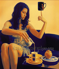 A lady pouring out a coffee or tea - A lady pouring out a hot drink