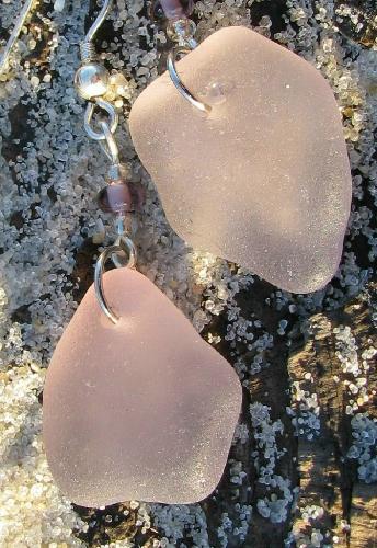 Amethyst earrings - Same earings as 2 spots over, but what a difference a 'real' camera makes! These 2 beach glass gems come from the beaches of northern California. Amethyst beach glass is becoming harder to locate and these beauties are jewelry quality. Check my profile for more info!