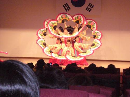 Korean Performers - This picture was taken while I was in Korea. I was one of the females pick out of my company to go to the Korean Exchange Day. I enjoyed watching this performance. They were incredible, the way they used their fans. I wish you could actually see it. It just looked so graceful as the turned in the circle. I had recorded it but I don't think I can upload it to this site. But if you ever get a chance to see them perform you should go check it out. It's very different from any other performances I've ever seen.