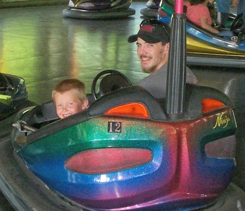My son on the bumper car 12 - this is my son and husband on a bumper car which just so happens to be number 12 My son on the bumper car 12 - this is my son and husband on a bumper car which just so happens to be number 12
