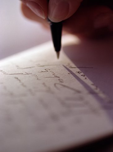 writing about my life - its a very dramatic photo..it looks classic in black and white..and it shows a lot of emotions about writing anything on a piece of paper that means a hundred meanings..