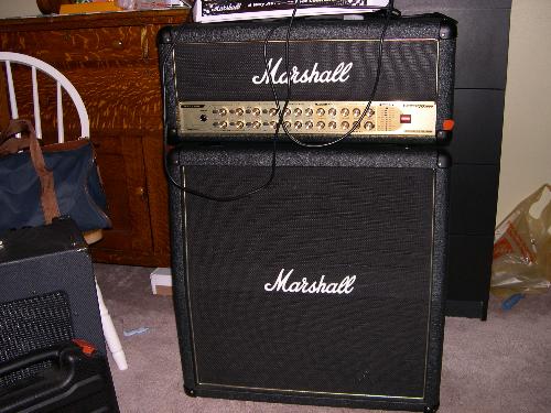 Marshall Half Stack - This is a picture of my Marshall half stack. It is an Avt150h and the avt412 speaker cabinet. These heads have now been discontinued and reissued as the avt150x. The trade mark of the AVT series (namely the cabs) is the gold piping around the trim.