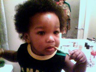 Him Brushes Teeth, Good Baby -  This is a picture of my one year old nephew attemting to brush his teeth. 