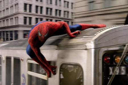 Spiderman saves the people on the train - Spiderman trying to save all these people on the train without getting killed by Doc. He was a cool villian. I love this scene cause he loses his mask and the people inside the train tell him they promise to protect his secret identity and put the mask back on him and help him up. If only all people will helping in this world. We would all live in a better world.
