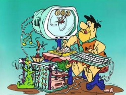 stone age computer - so heres our first computer back in the stone age times. that must have been one hard computer to use. Poor Fred don't know how to use it. for beginners it is a hard piece of machinery to run and learn.
