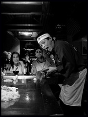 A Japanese restuarant - This shows a man serving at a Japanese restuarant A Japanese restuarant - This shows a man serving at a Japanese restuarant