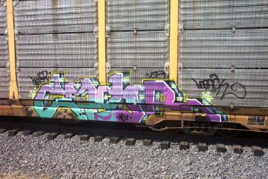 Graffiti  - On the side of a passing train car