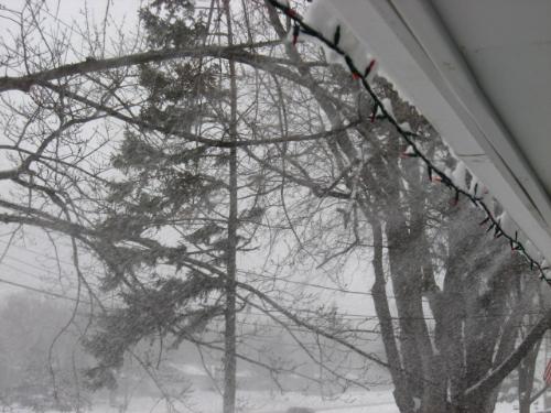 Blowing from the roof - snow being blown from the roof. The wind is making driving really bad right now during rush hour