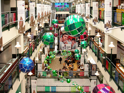 shopping - This is a shopping mall, the Eaton Centre, found in Montreal, Canada. It is all decked out for Christmas  in this photo.