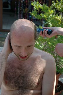 Is cutting your hair a special occasion? - A picture of a person having his hair cut. Photo source: http://farm1.static.flickr.com/10/16096936_a65bf69b23.jpg?v=0 .