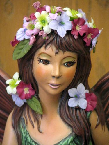 fairy - This is a close up of the fairy's face. The artificial flowers really bring her alive.