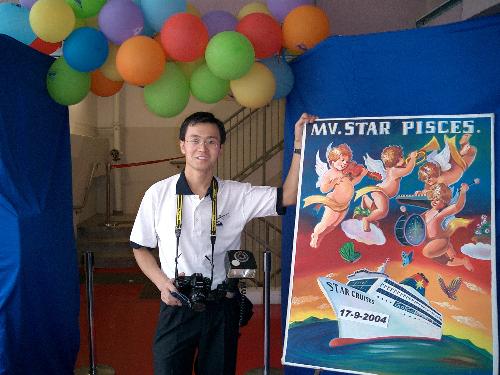 photographer - This photo was taken when i was working in Hongkong star crusies the name of the ship is star pisces.At that time i was a photographer there and you can see the date from the picture.Every passenger who need to pass this entrance need to take photo.and if they like their photo they need to buy.It is not cheap,maybe 7 or 8 dollars per piece.