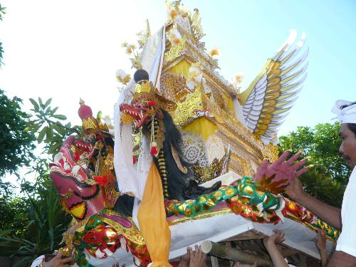 ceremony - The picture is telling about purification ceremony held by Hindu in Bali. The ceremony is done after Hindu finished the cremation process. After cremation,Hindu believe that the soul are not pure enough to gain the main soul but after purification process, the souls are pure and holly. The process ended by throwing all the element to the ocean.