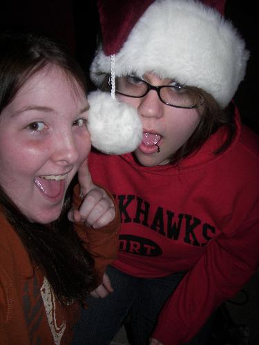 allie and me - Having fun with my Santa hat. Allie is wearing the Santa hat, the other one is me.