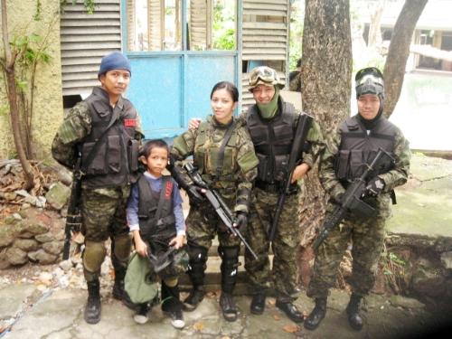 Sibling Soldiers - This photo was taken at the abandoned school playsite from my other pics. These here are my brother, his son, my sister, her husband. So its a great game for us because it 'binds' our relationships further as siblings.
