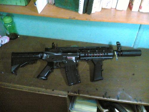 My other weapon - This is my m4a1 RIS with a 4' suppressor. This is my primary weapon for most CQB/CQB scenario engagements. A very reliable weapon, a bit modified though, with a shorten barrel length so that maneuvering in tight corners, rooms, doorways, hallways will be easier than using a standard m4a1 or m16 rifle. Again this is only a replica of the real gun, but with most of the design having a slight 1:1 ratio, it could easily be mistaken for the real thing that's why I take extra caution and special care whenever I bring it to the gamesites.